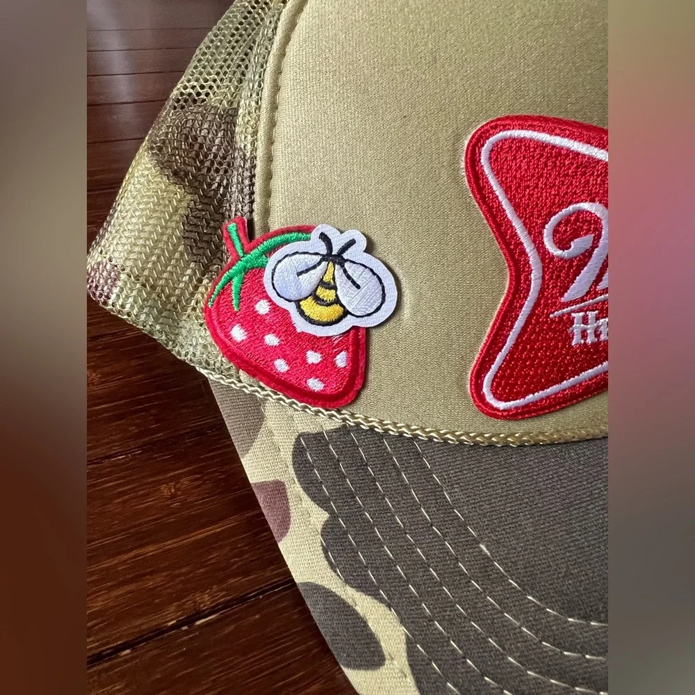 camouflage-patterned Miller High Life trucker hat featuring embroidered patches. - Picture 2 of 5